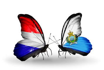 Two butterflies with flags Holland and San Marino