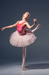 Naklejka premium Portrait of the ballerina in ballet pose
