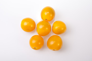 Yellow shiny cherry tomatoes