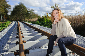 Portrait of beautiful woman at railways