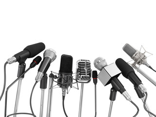 Various microphones aligned at press conference isolated over a - obrazy, fototapety, plakaty
