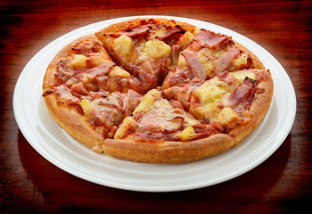 Pizza on the plate isolated on white background