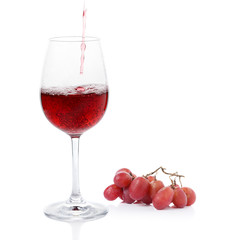 Poured red wine ,grapes of wrath on white background