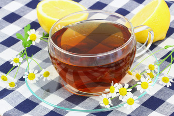 Tea with chamomile flowers and lemon