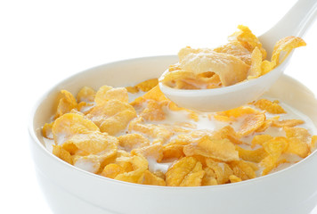 cornflakes and milk isolated on white