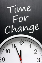Fototapeta na wymiar The phrase Time For Change on a blackboard above a clock