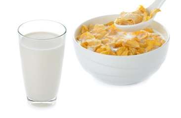 milk and cornflakes on white background