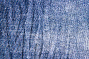 Crumpled vintage jeans texture.