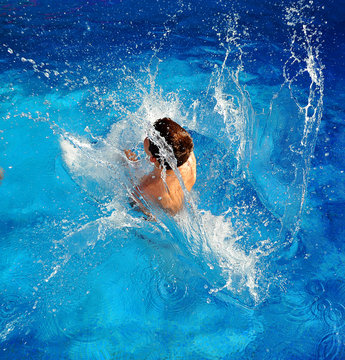 Child in swimming pool, summer vacation