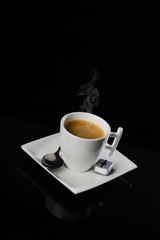 isolated studio shot smoking espresso coffee on black background