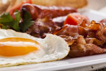 Poster Full english breakfast with bacon, sausage, fried egg, baked bea © gkrphoto