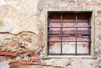 Old window with iron gratings