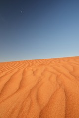 Desert sand pattern with deep blue sky