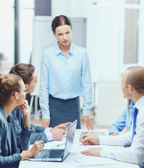 strict female boss talking to business team