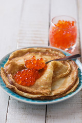 Pancakes with red caviar.
