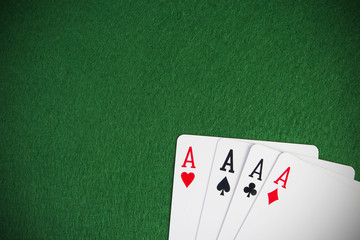 four aces high on green table