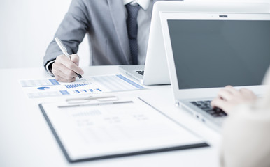 Business people discussing the charts and graphs showing the res