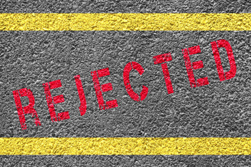 Rejected sign on the asphalt