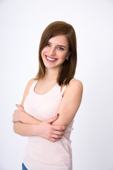 Obraz premium Portrait of a cheerful woman standing over gray background