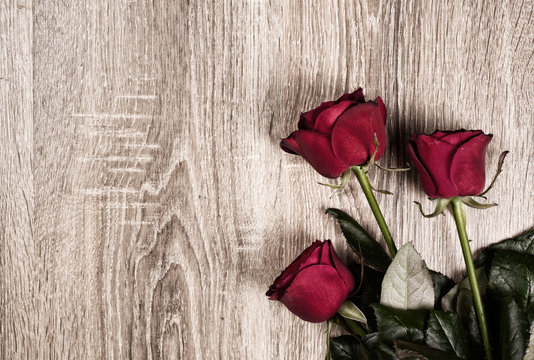 Red Rose Flowers On Wood Background