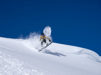 Snowboarder moving down
