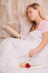 Morning surprise. Side view of beautiful young woman lying in be