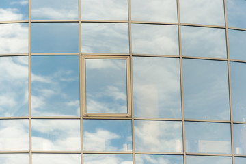 Fototapeta na wymiar Blue sky reflected in windows