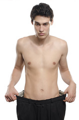 Fototapeta premium Man lost weight, his larger pants from the days he was fat