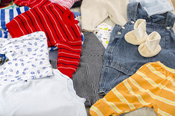 Colorful wardrobe of newborn,kids, babies full of all clothes