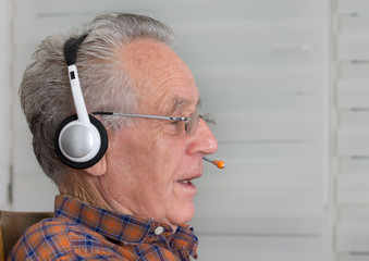 Old man with headset
