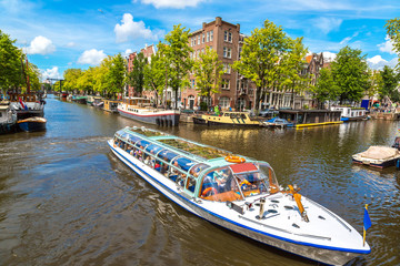 Fototapeta premium Amsterdam canals and boats, Holland, Netherlands.