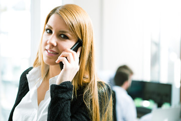 Office worker making a phone call understanding the importance o