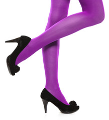 Woman long legs and violet stockings isolated