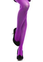 Woman long legs and violet stockings isolated