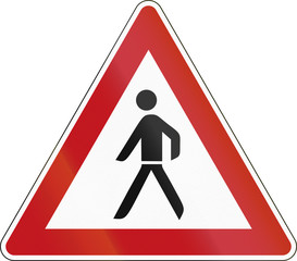 German sign warning about pedestrians on the road