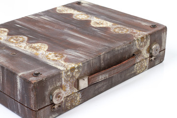 Vintage brown suitcase on white background