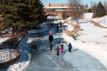 People ice skating on a frozen lake