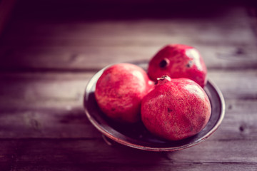 Pomegranate on wooden background
