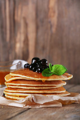 Stack of pancakes with mint and berries