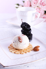 Dessert with prunes and ice cream and bouquet of roses