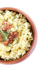 Rice with walnuts and rosemary in plate isolated on white
