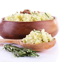 Fotobehang Rice with walnuts and rosemary in plate isolated on white © Africa Studio