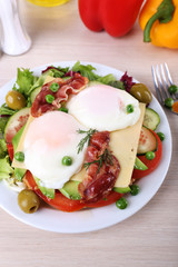 Sandwich with poached eggs, bacon and vegetables