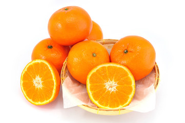 Group of orange fruit on bamboo basket