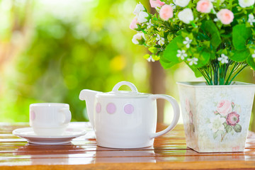 Fototapeta na wymiar White porcelain set for tea or coffee on wooden table