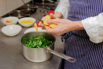 Chef is cooking parsley sauce