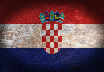 Old rusty metal sign with a flag