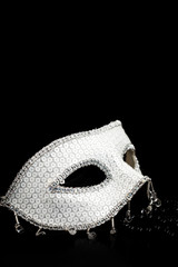 Silver glittering mask and black pearls