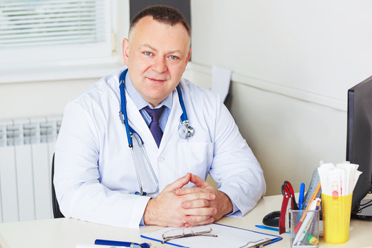 Portrait of Doctor with stethoscope looking at the camera.