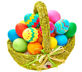 Painted Easter Eggs in decorated Basket on white background